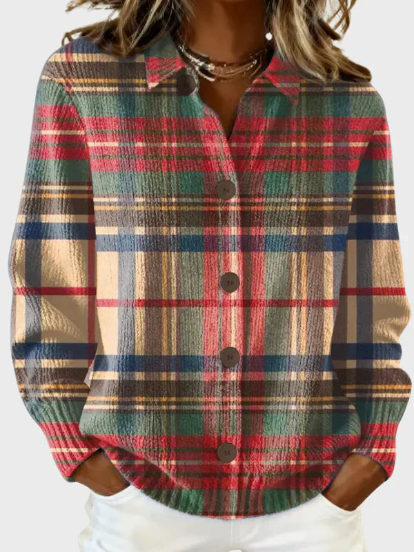Plaid knit cardigan in red, green, beige, and navy with button front and collar.