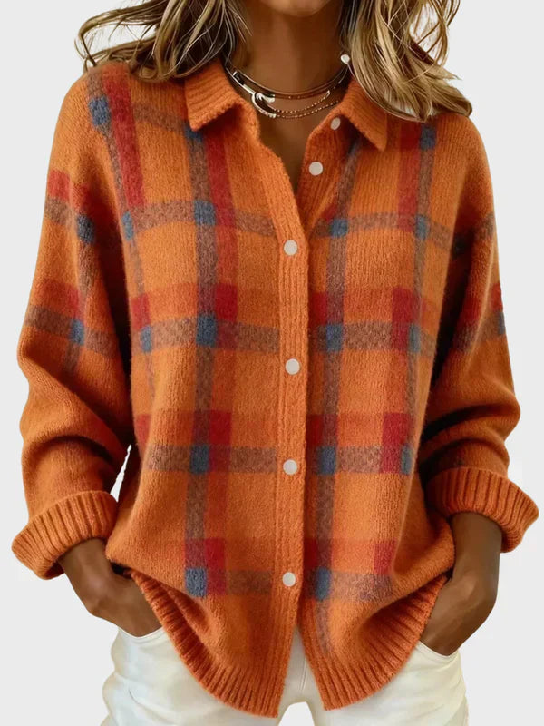 Burnt orange plaid knit cardigan with spread collar, button front, and ribbed cuffs.