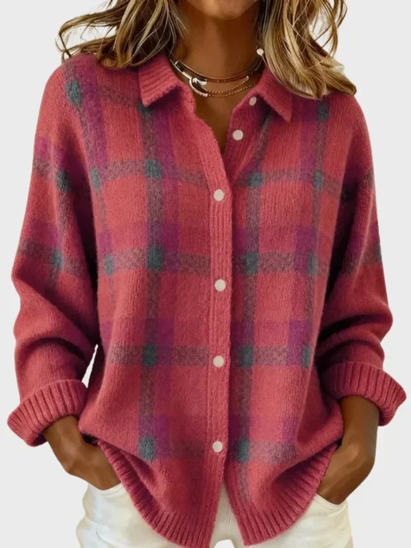 Burnt orange plaid knit cardigan with button front and relaxed fit, rolled cuffs, and collared neckline.