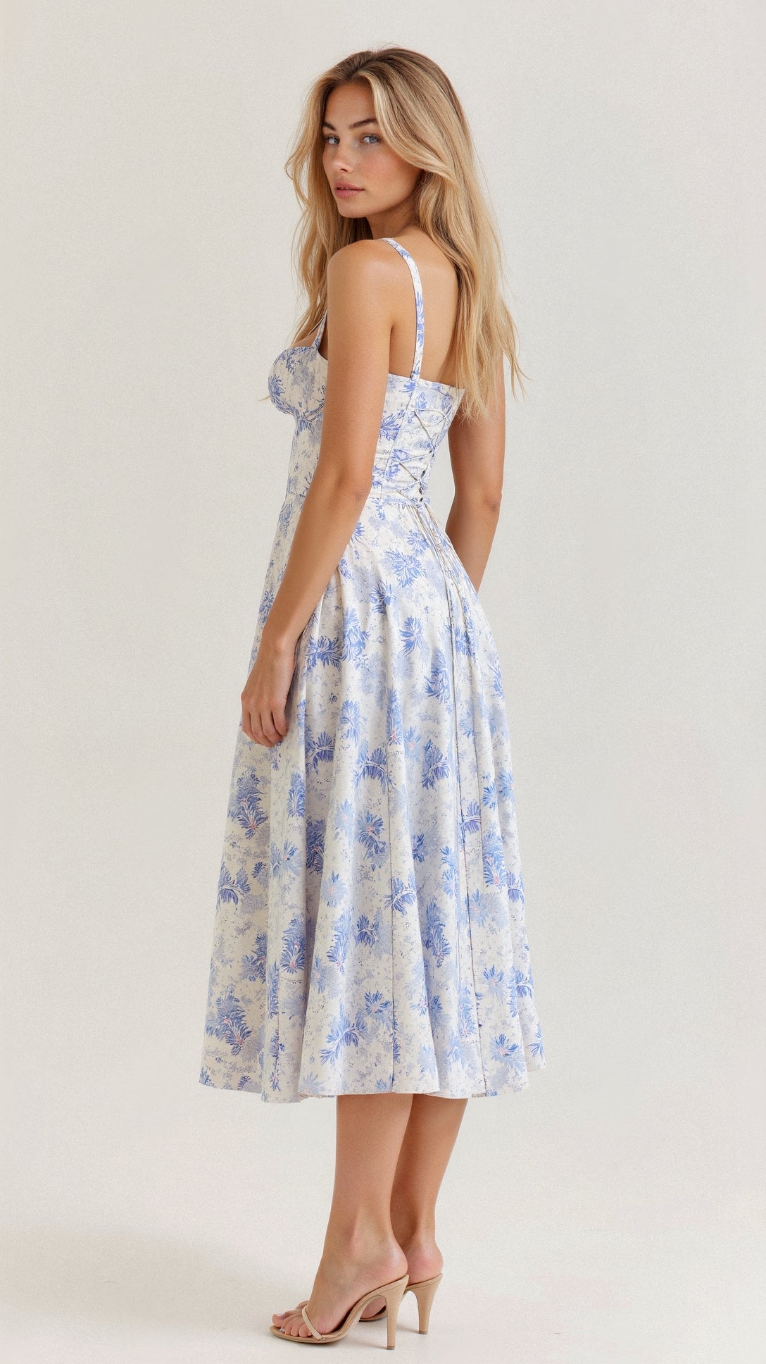 Woman wearing a floral dress on a white background