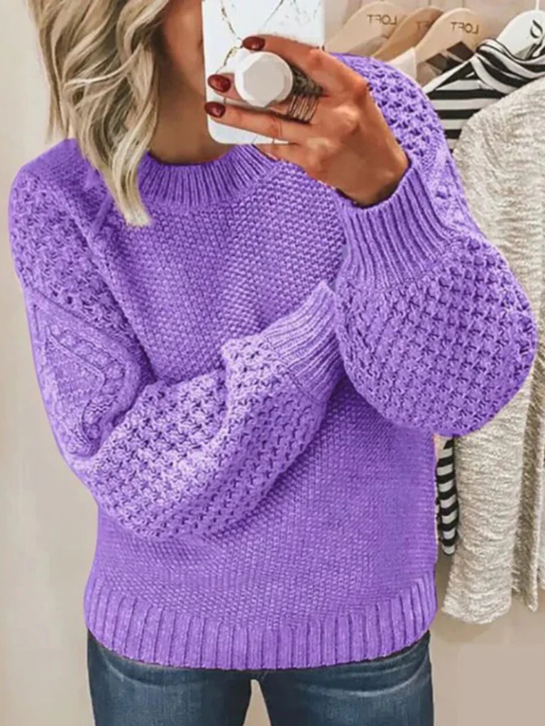 Lavender knit sweater with textured balloon sleeves and ribbed cuffs and hem.