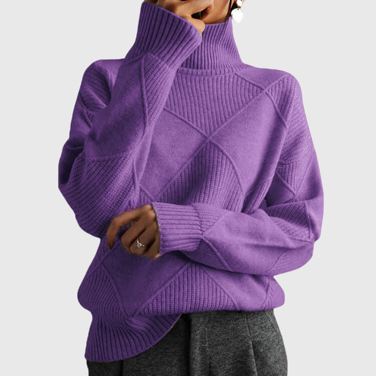 Purple turtleneck sweater with textured diamond knit pattern and ribbed cuffs and hem.