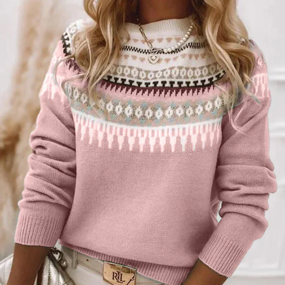 Pink knit sweater with multicolor Nordic pattern yoke and ribbed cuffs and hem.