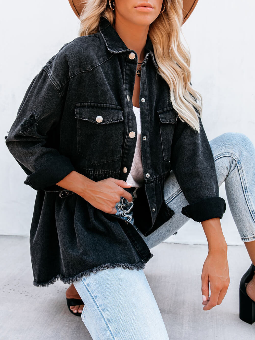 Women's black distressed denim shirt jacket — front detail