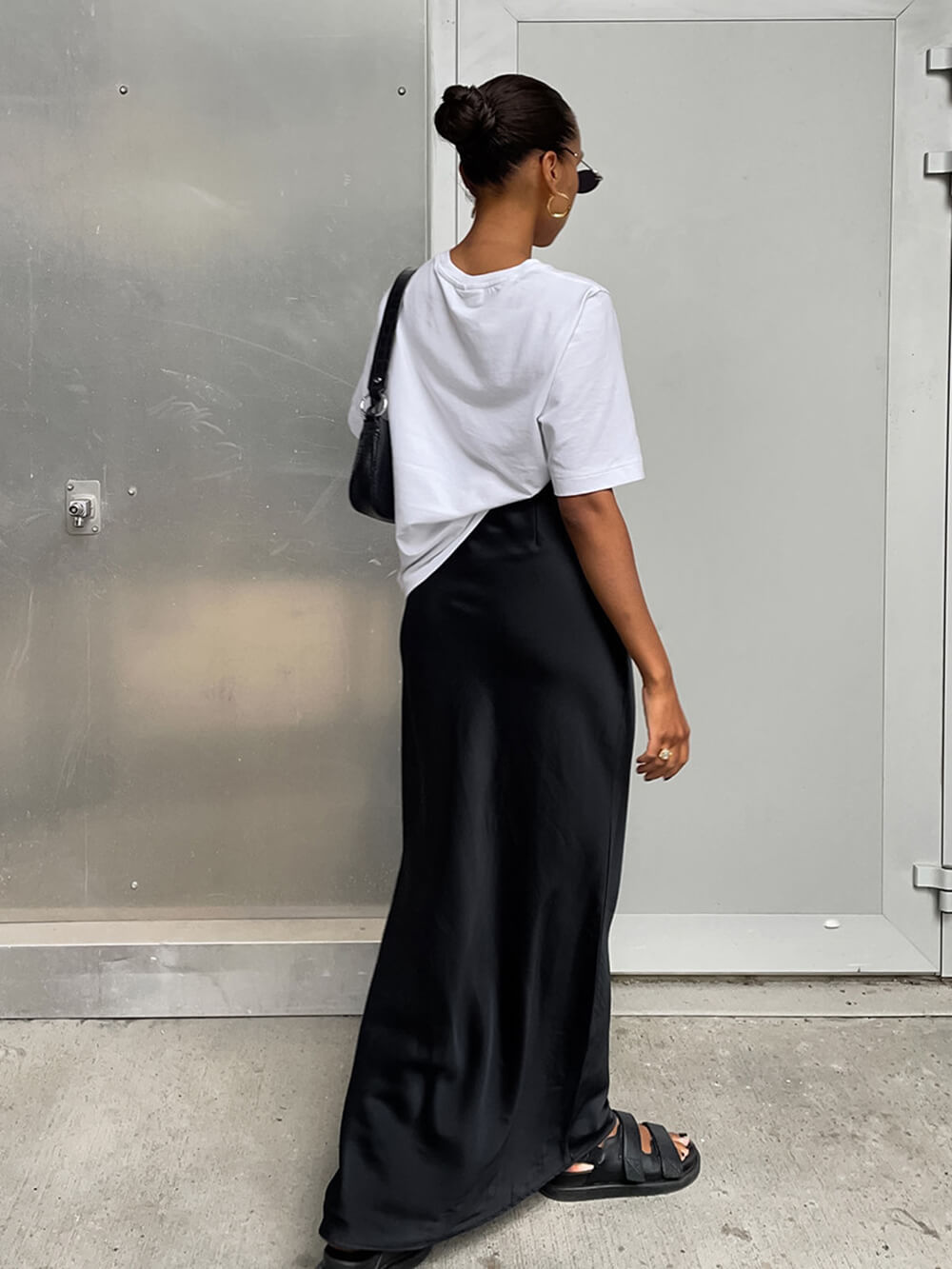 Women's black high-waist satin fishtail maxi skirt — side view