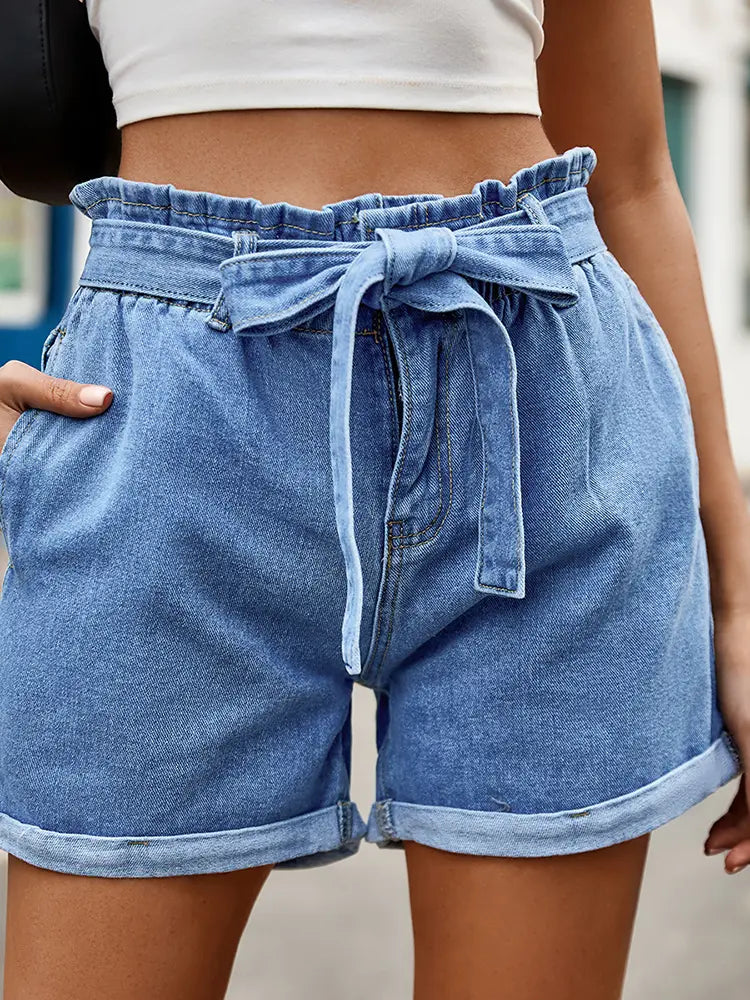 Women's blue denim shorts with bow tie — detail view