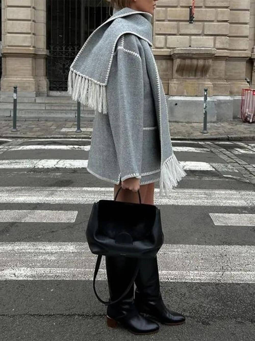 Women's draped fringed wrap jacket — close-up detail