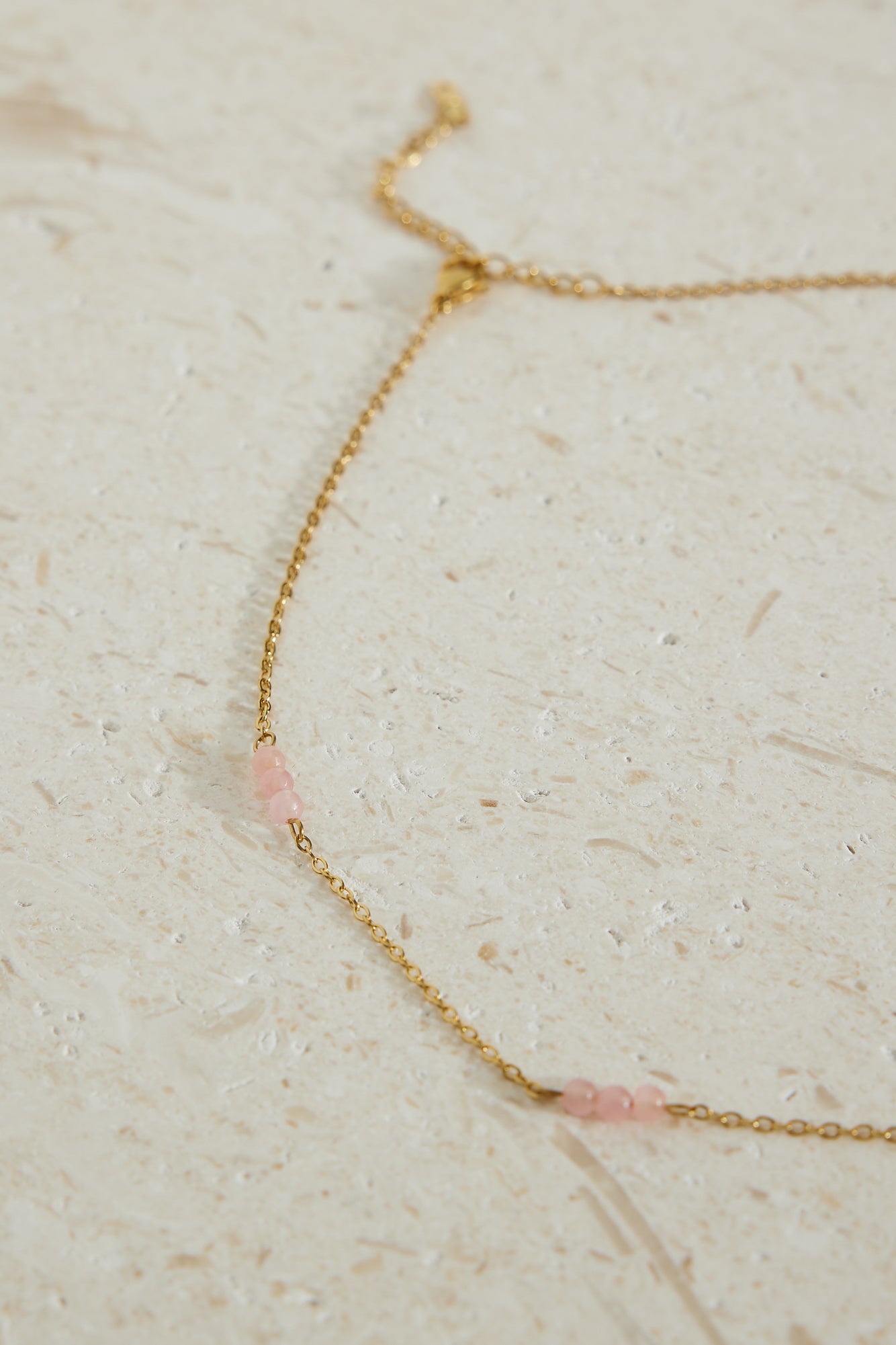 Women's gold chain pink bead necklace — detail view