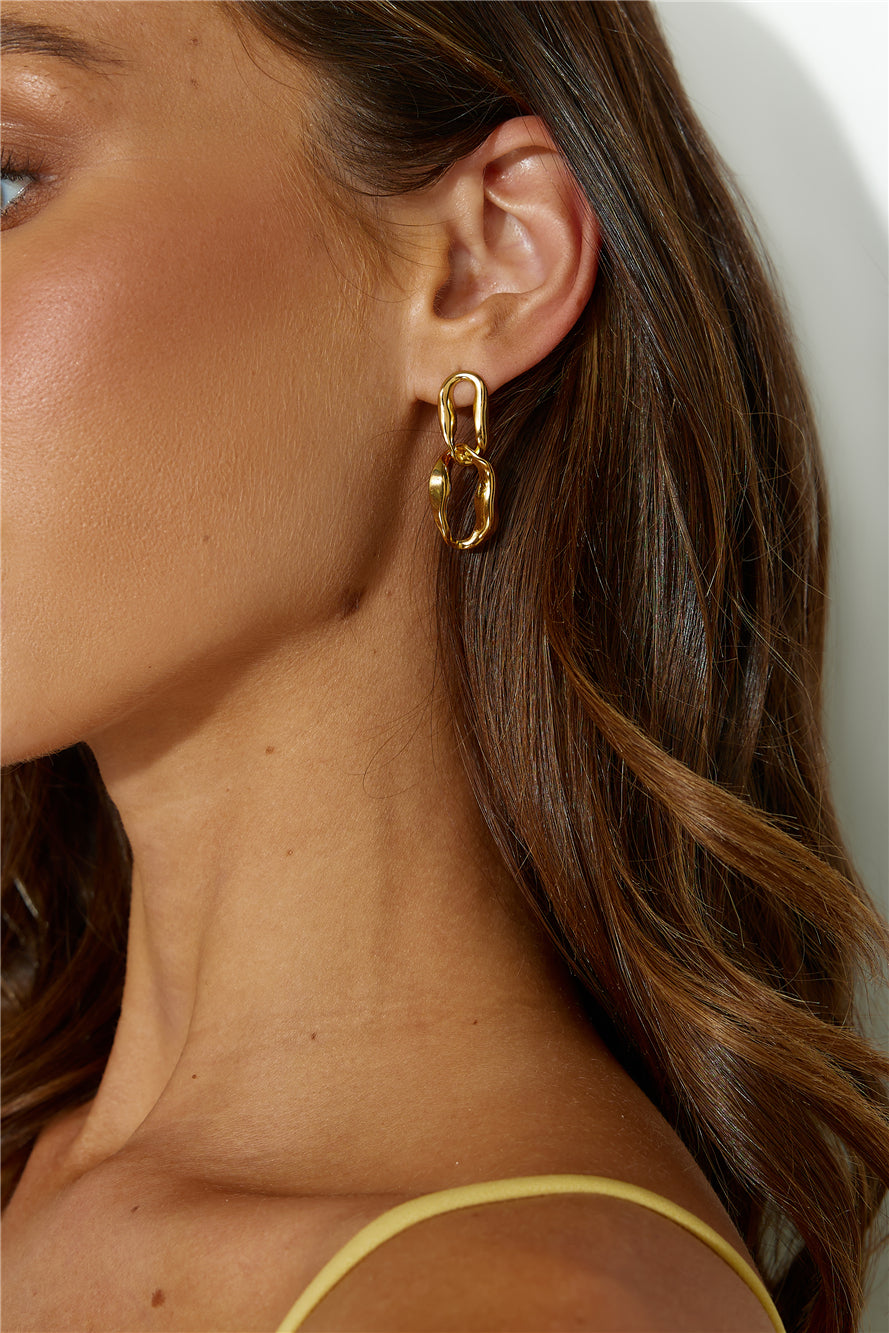 Women's gold dangle earrings — alternate angle