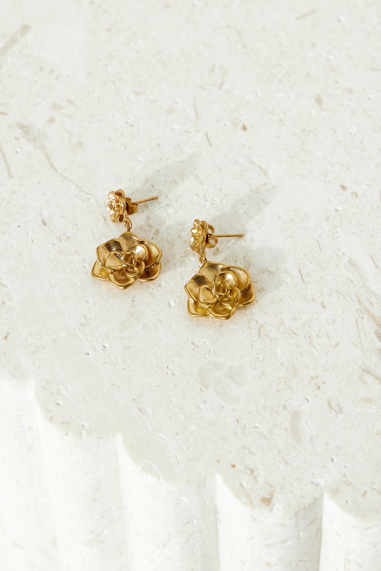 Women's gold double flower earrings — alternate angle