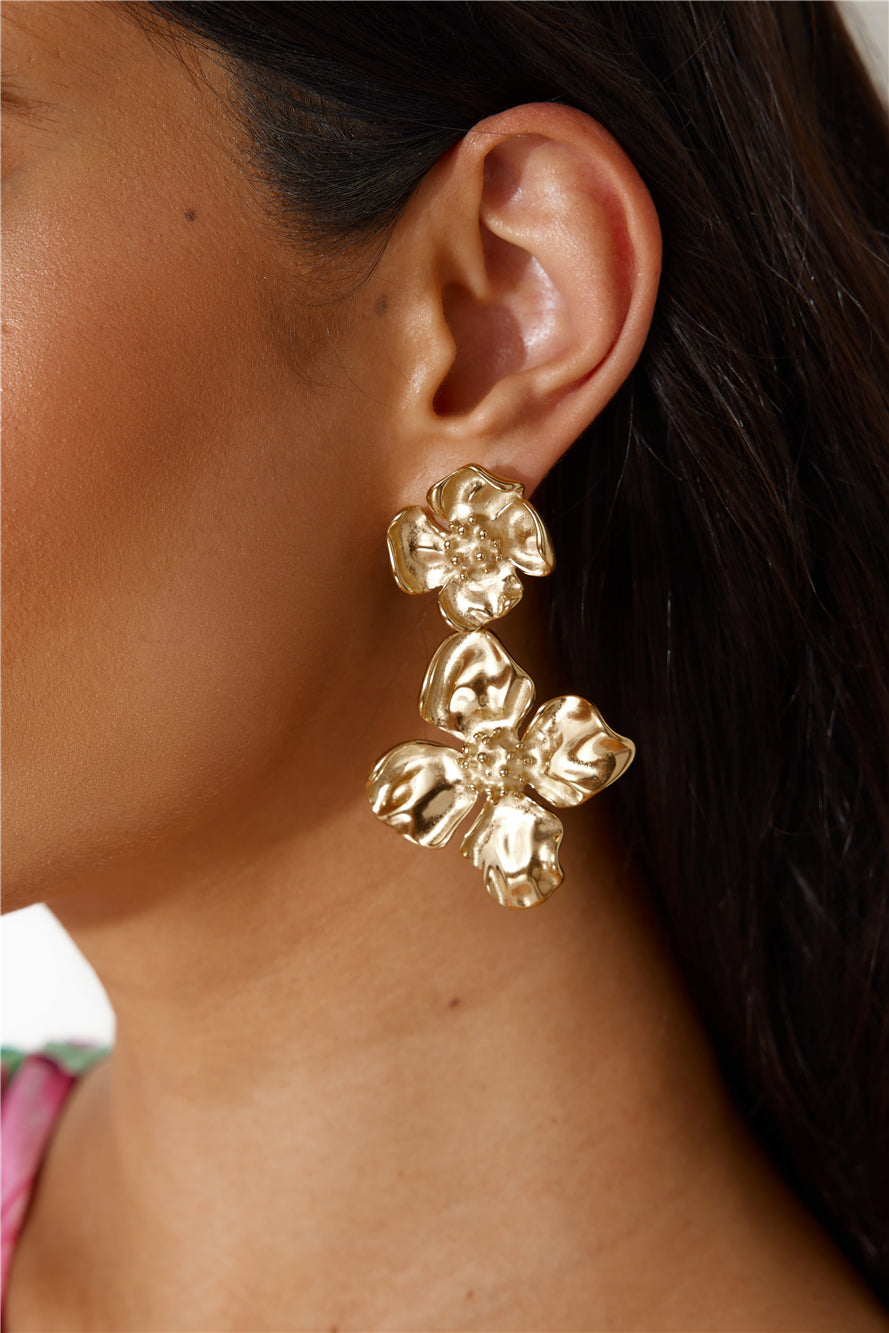 Women's gold flower dangle earrings — alternate angle