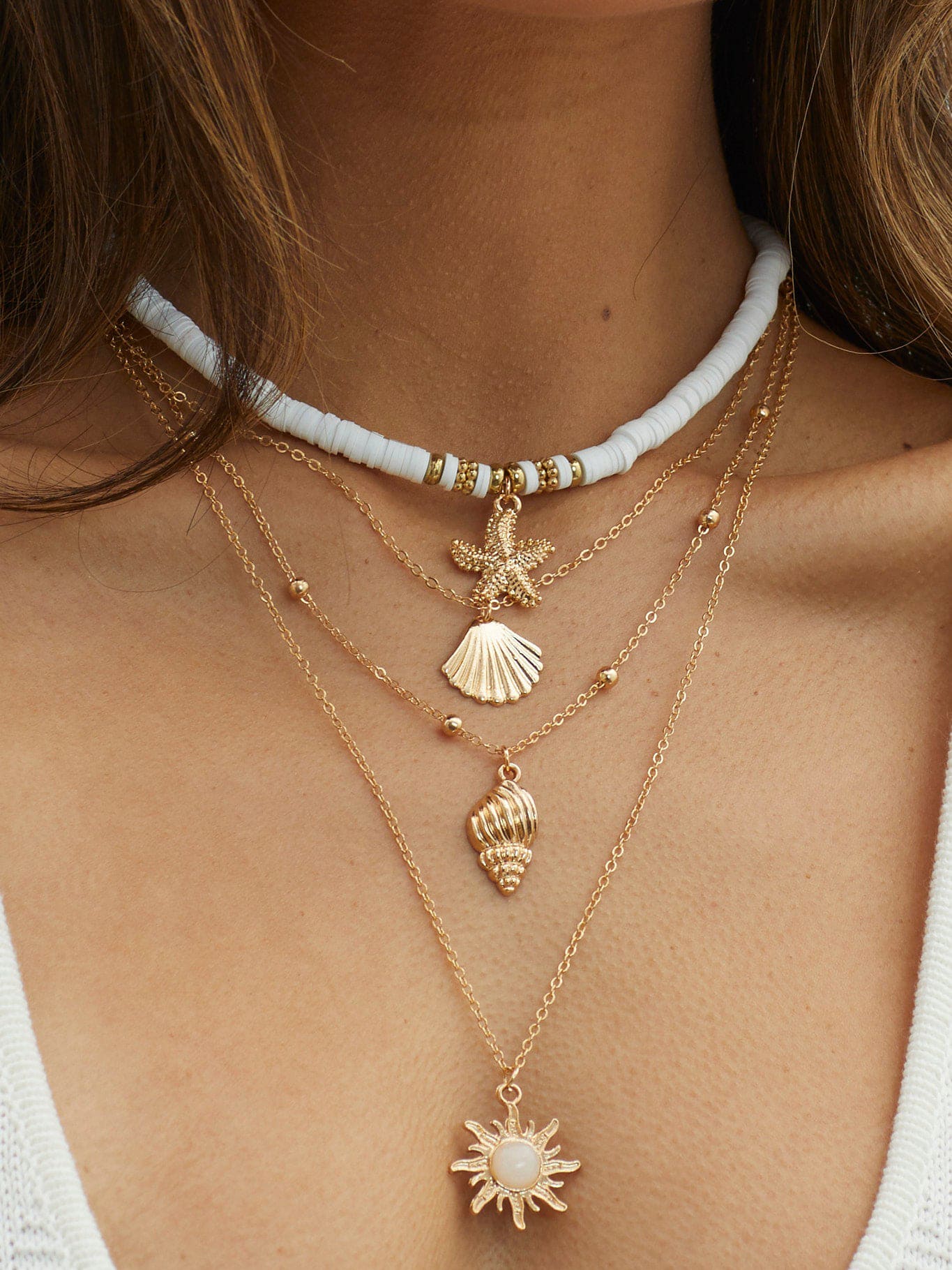Women's gold layered shell and starfish necklace