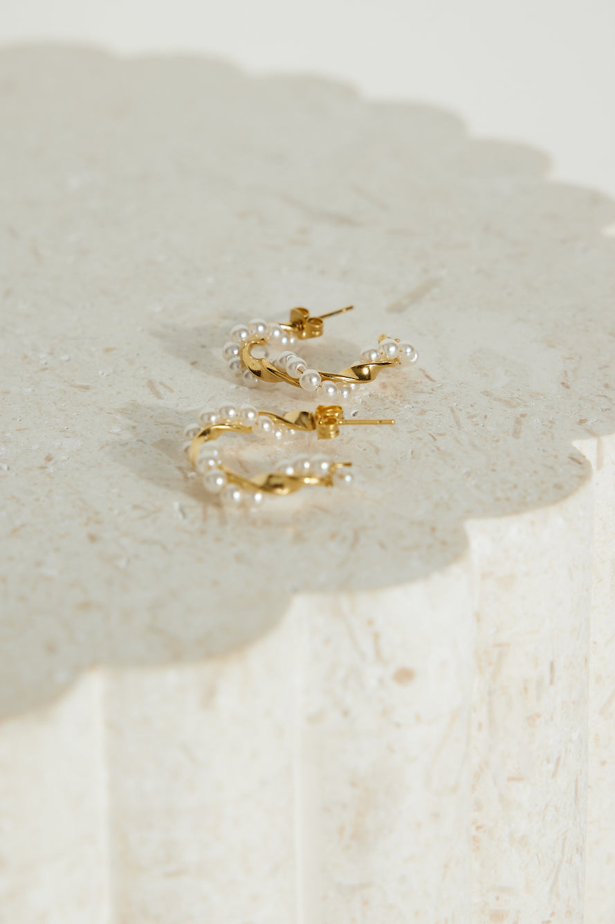 Women's gold pearl hoop earrings — alternate angle