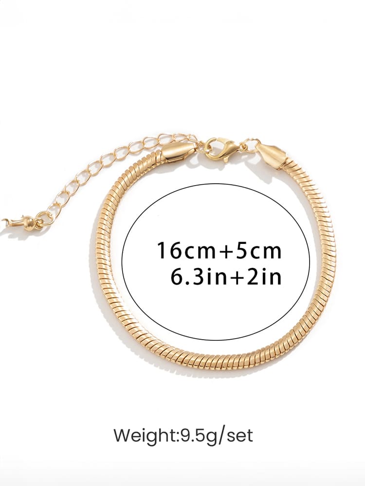 Women's gold flat snake-bone chain bracelet — worn on wrist