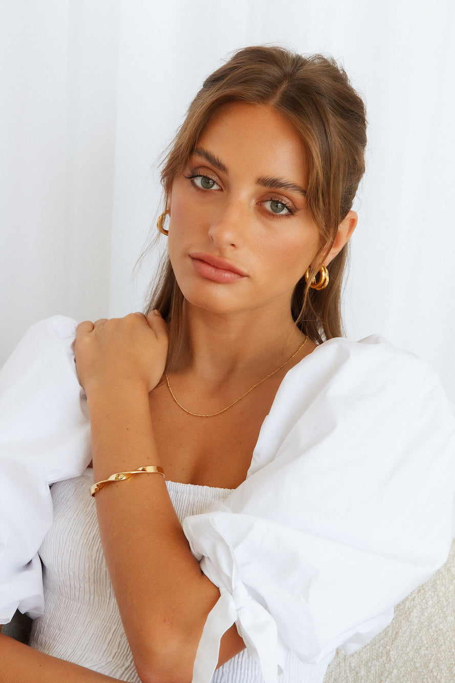 Women's gold staple hoop earrings