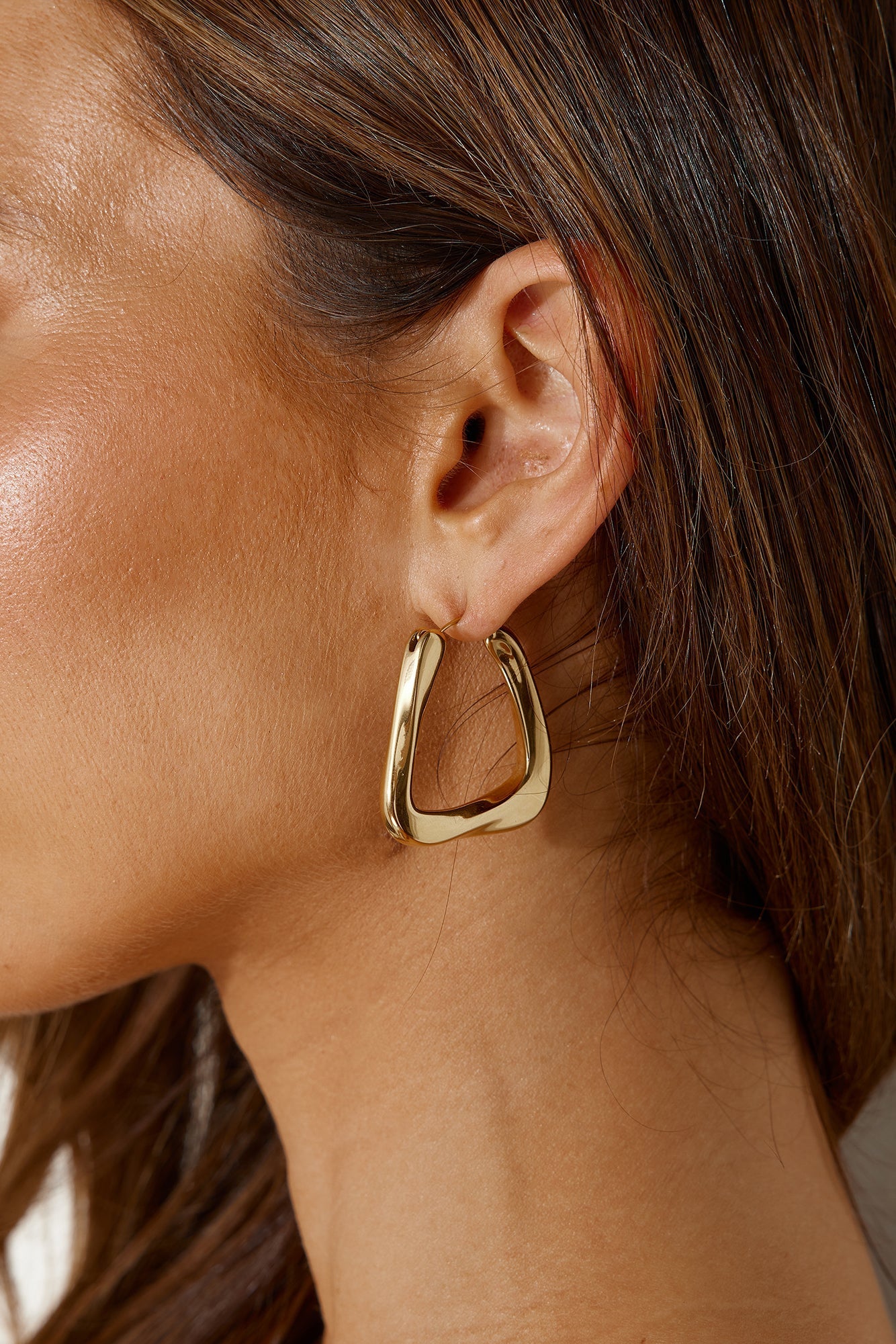 Women's gold statement hoop earrings