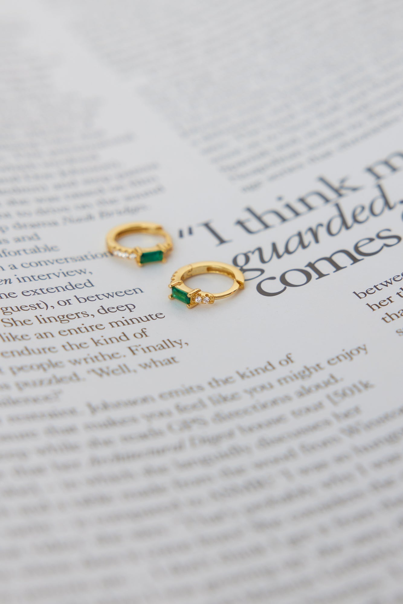 Women's green cubic zirconia hoop earrings — detail shot