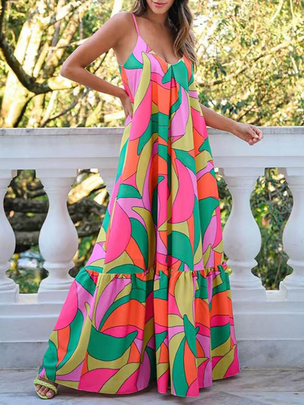 Women's printed halter maxi dress with deep V-neckline and open back