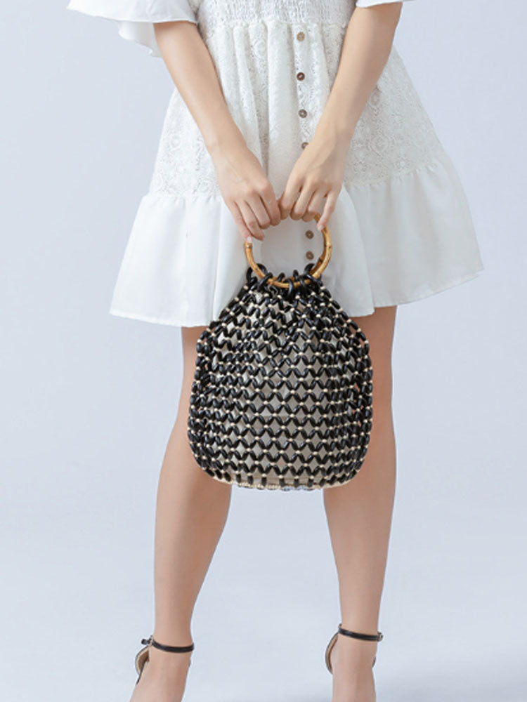 Women's handwoven wooden bead barrel bag