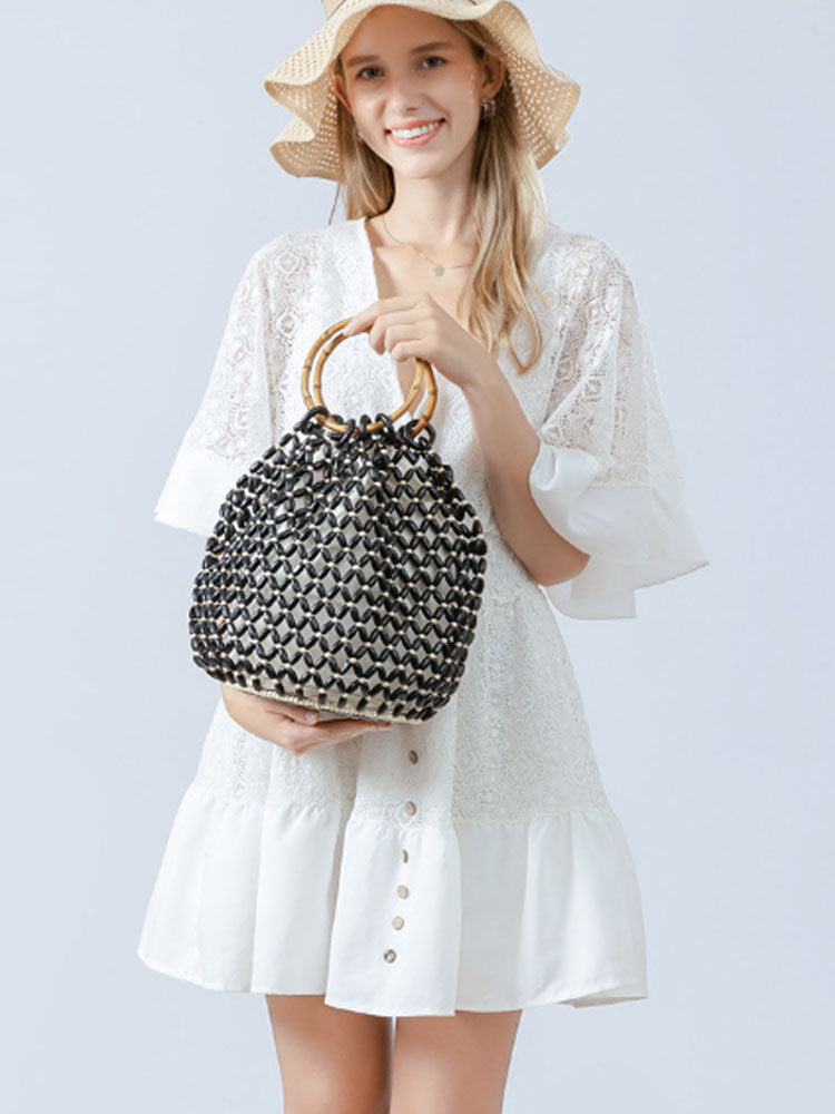 Women's handwoven wooden bead barrel bag — alternate angle
