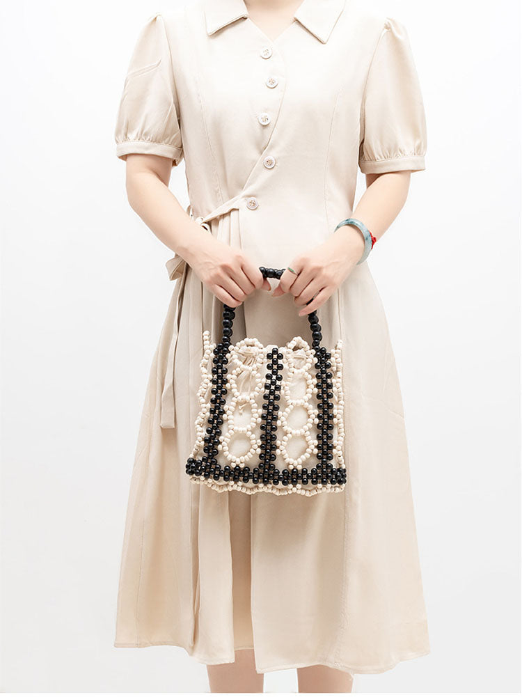Women's handwoven wooden bead tote bag — alternate angle