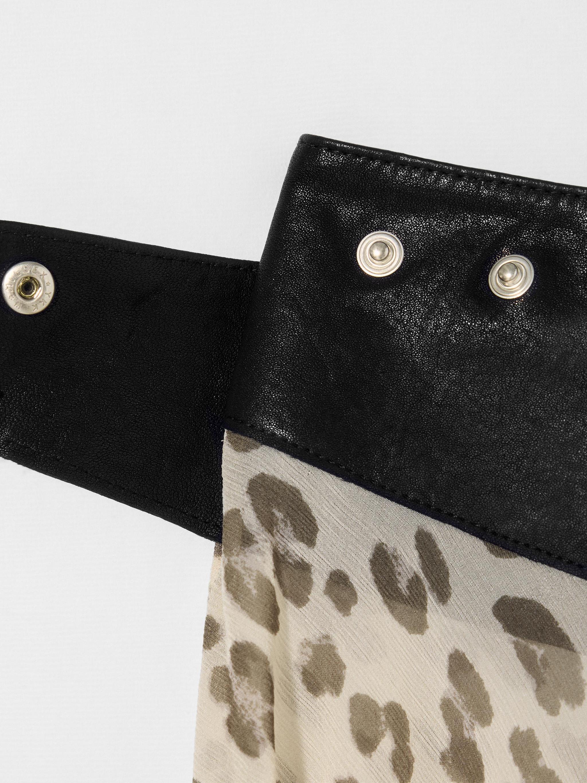 Women's leopard print asymmetrical mini skirt — back view