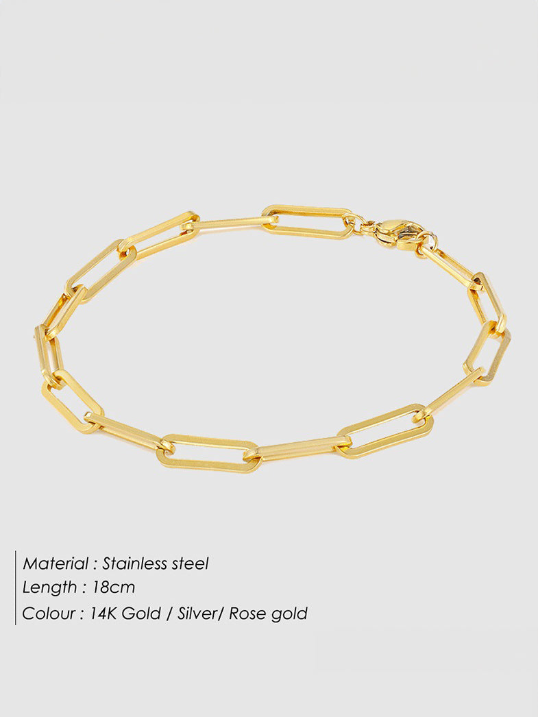 Women's gold link chain charm bracelet — worn