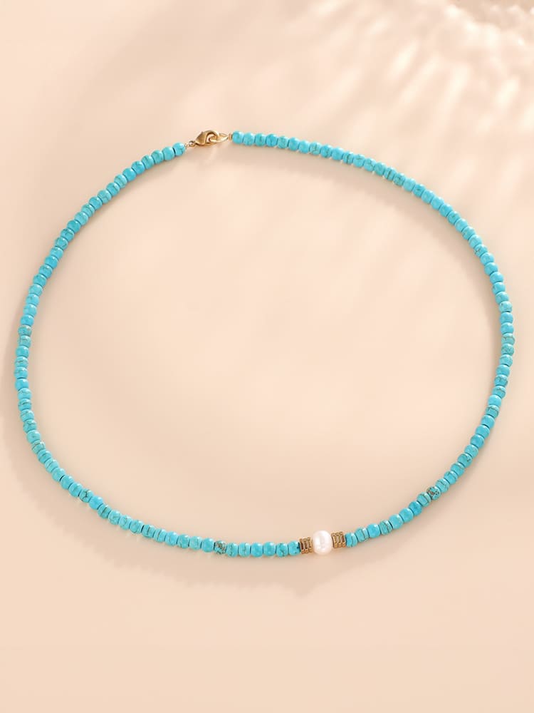 Women's turquoise and pearl beaded necklace — side detail