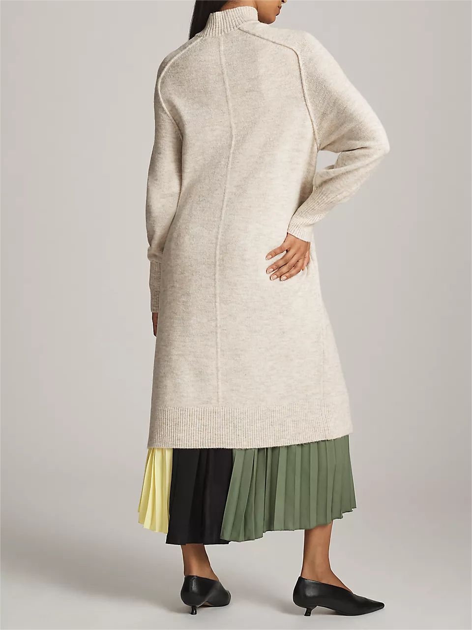 Women's neutral turtleneck sweater dress with split-front hem