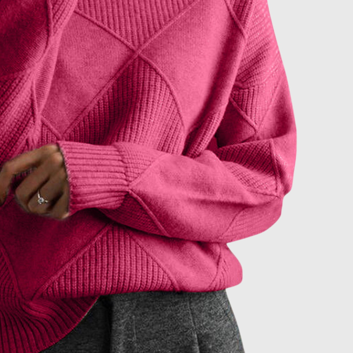 Dusty rose turtleneck sweater with textured diagonal knit pattern and ribbed cuffs.