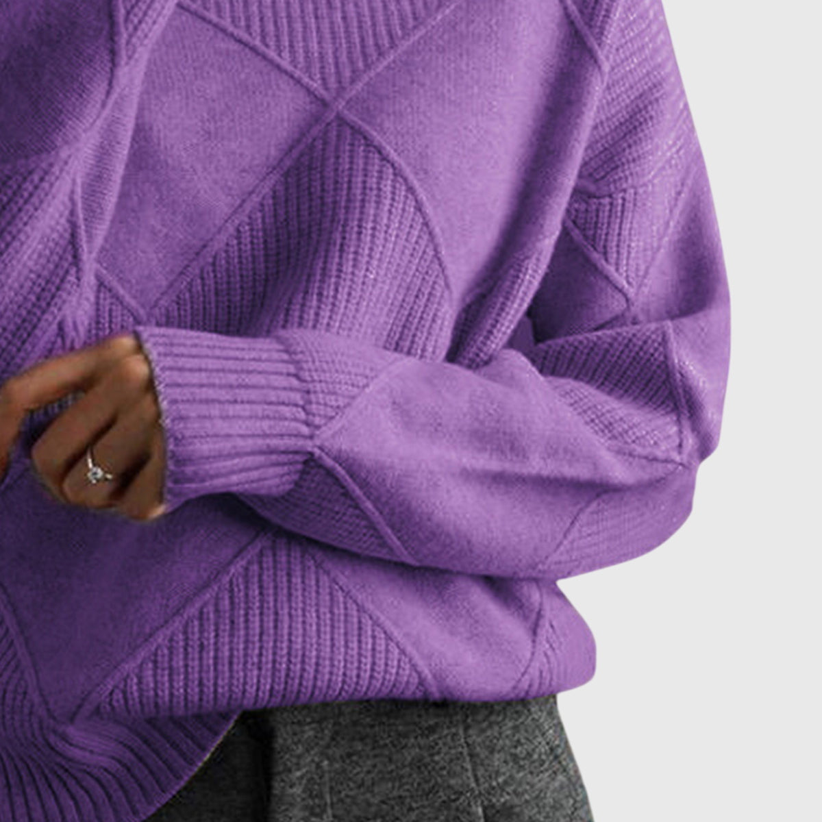 Iris purple turtleneck sweater with textured geometric knit patterns and ribbed cuffs.
