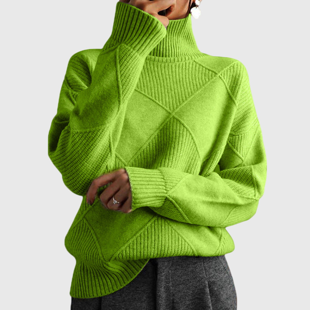 Bright green chunky knit turtleneck sweater with ribbed diamond pattern and long sleeves.
