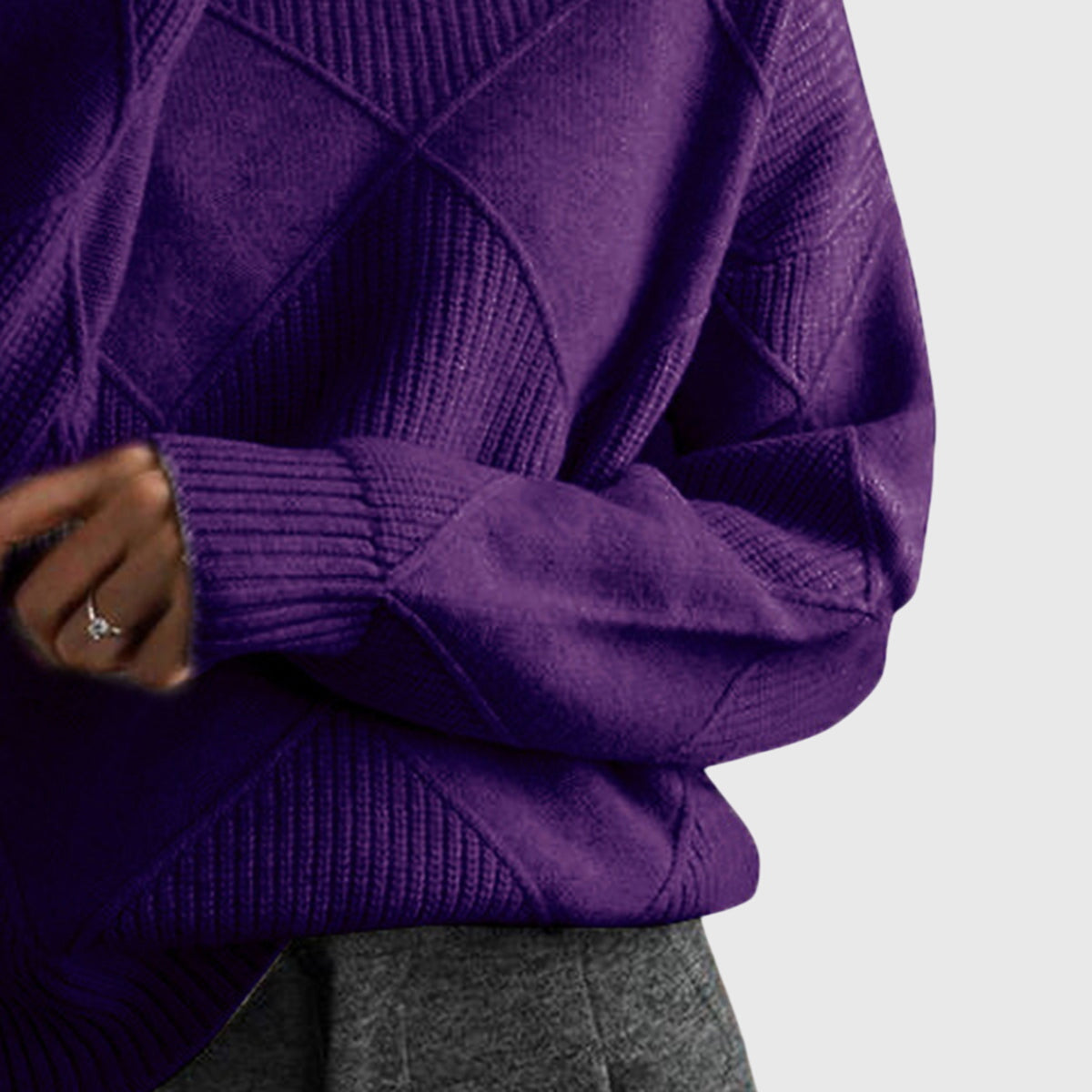 Purple knit turtleneck sweater with ribbed cuffs and geometric textured patterns.