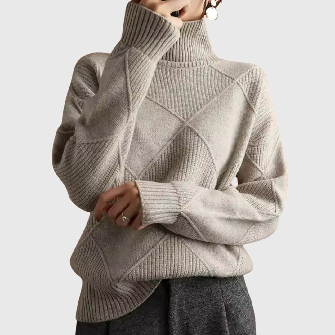 Light grey turtleneck sweater with ribbed diamond pattern and long sleeves.