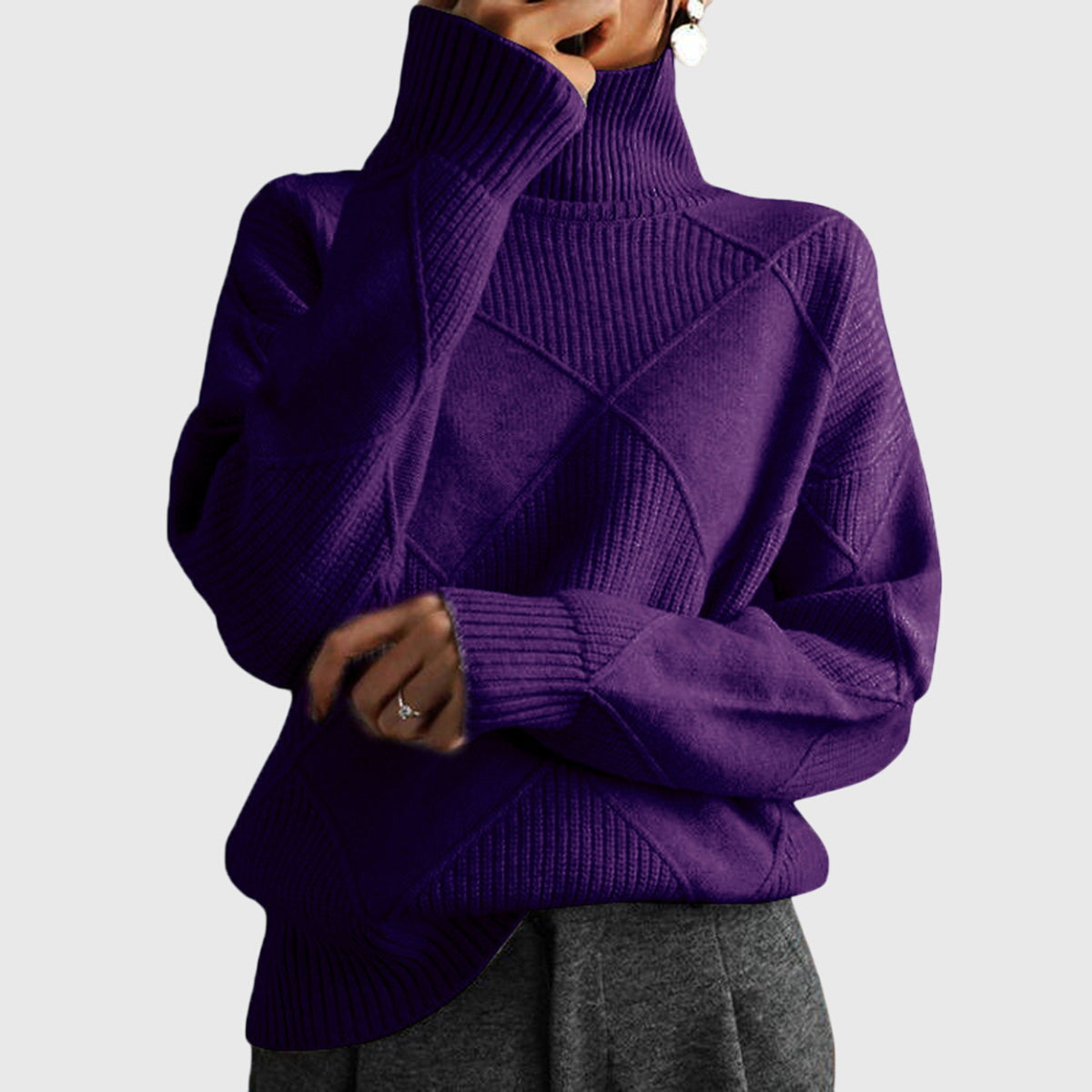 Deep purple turtleneck sweater with geometric knit patterns and ribbed cuffs and hem.