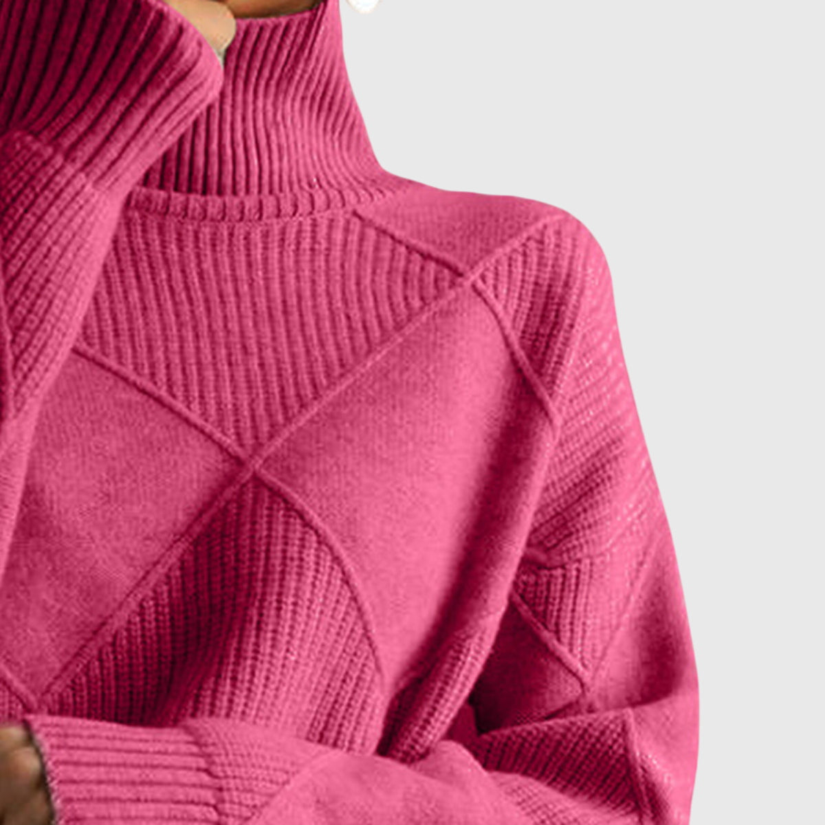 Dusty rose turtleneck sweater with geometric ribbed knit pattern and long sleeves.