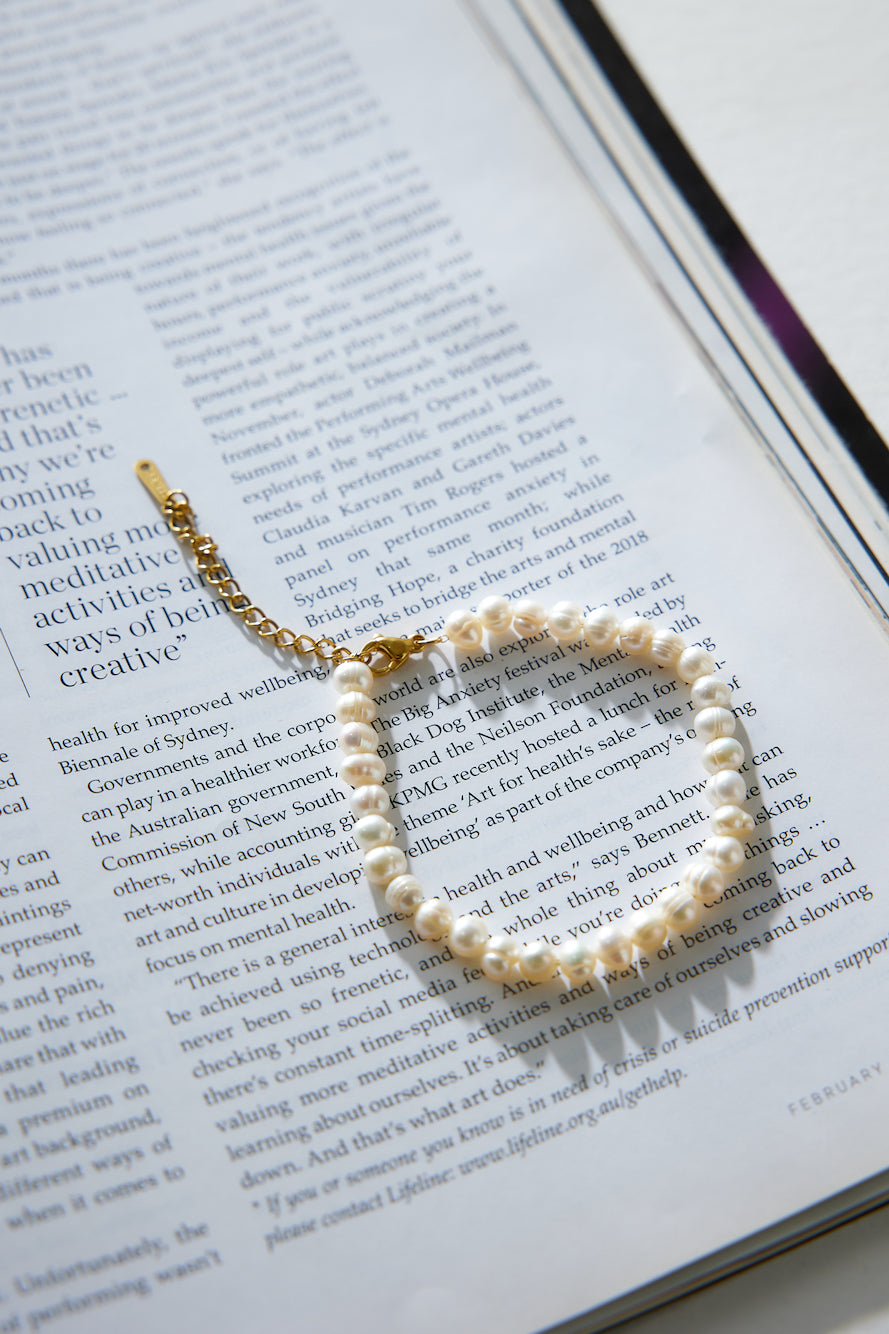 Women's gold pearl charm bracelet