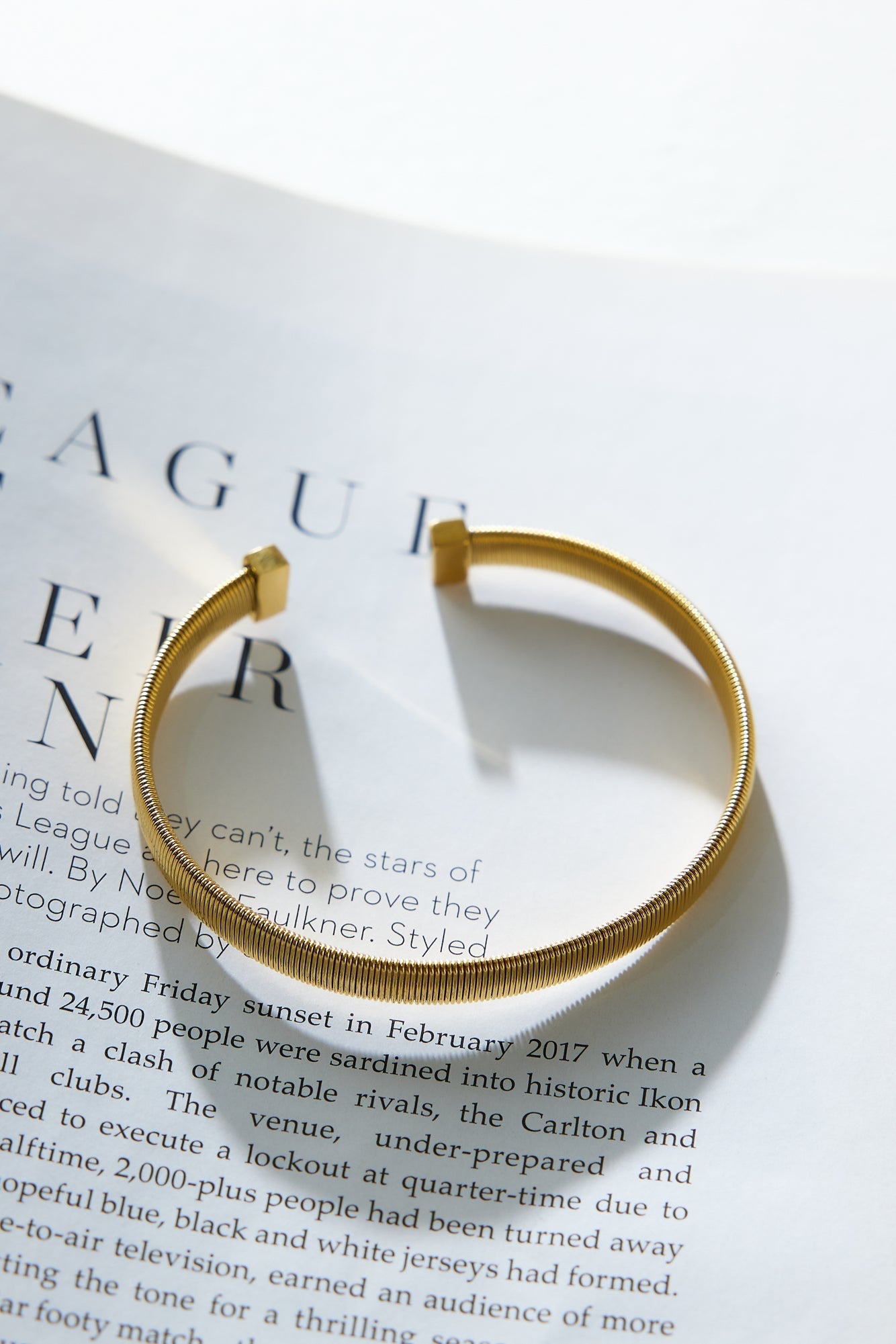 Women's open design gold bracelet — alternate angle