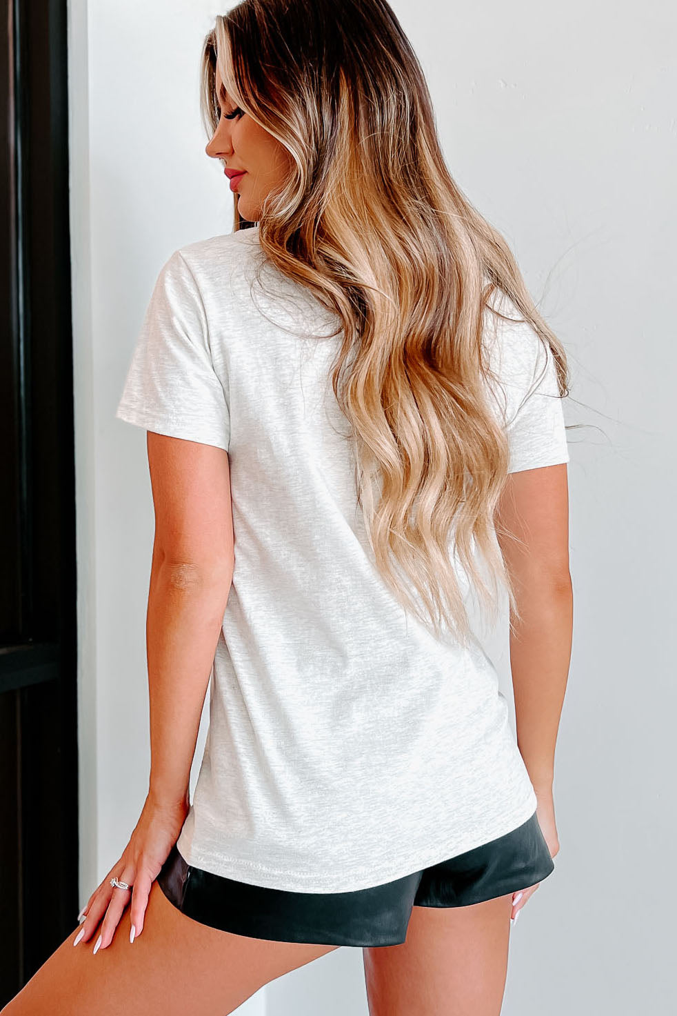 Women's beige graphic t-shirt with pumpkin print — side view