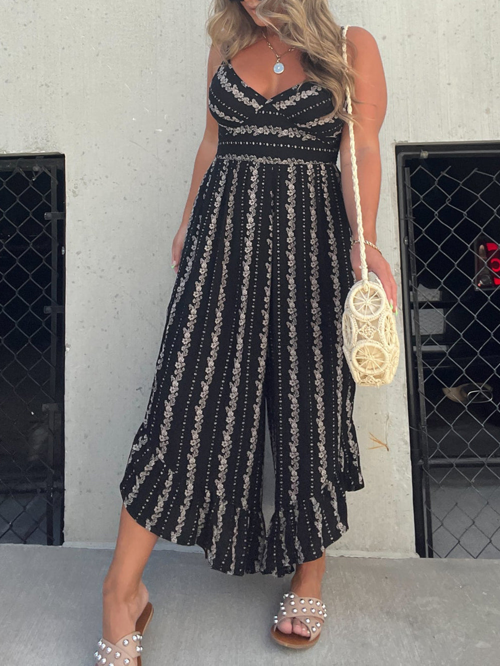 Women's black halter V-neck wide-leg jumpsuit — side detail