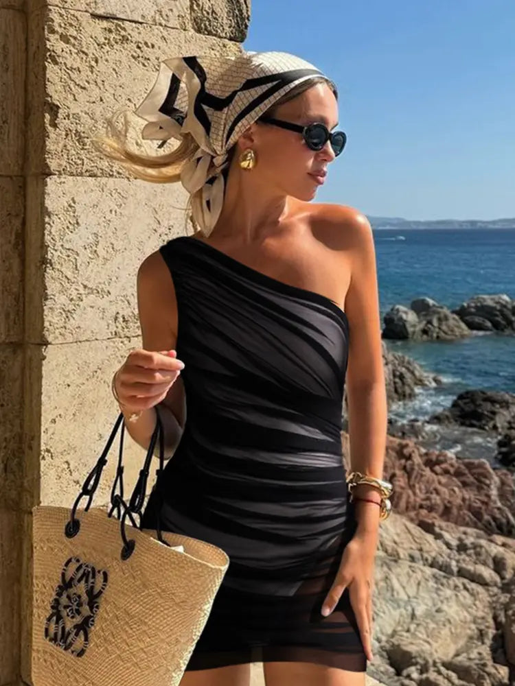 Women's black mesh one-piece swimsuit with wrap skirt