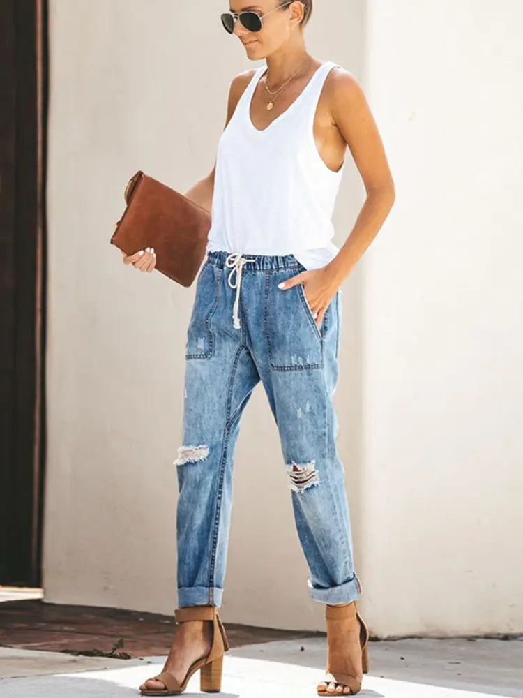 Women's Blue Ripped Denim Joggers — back view