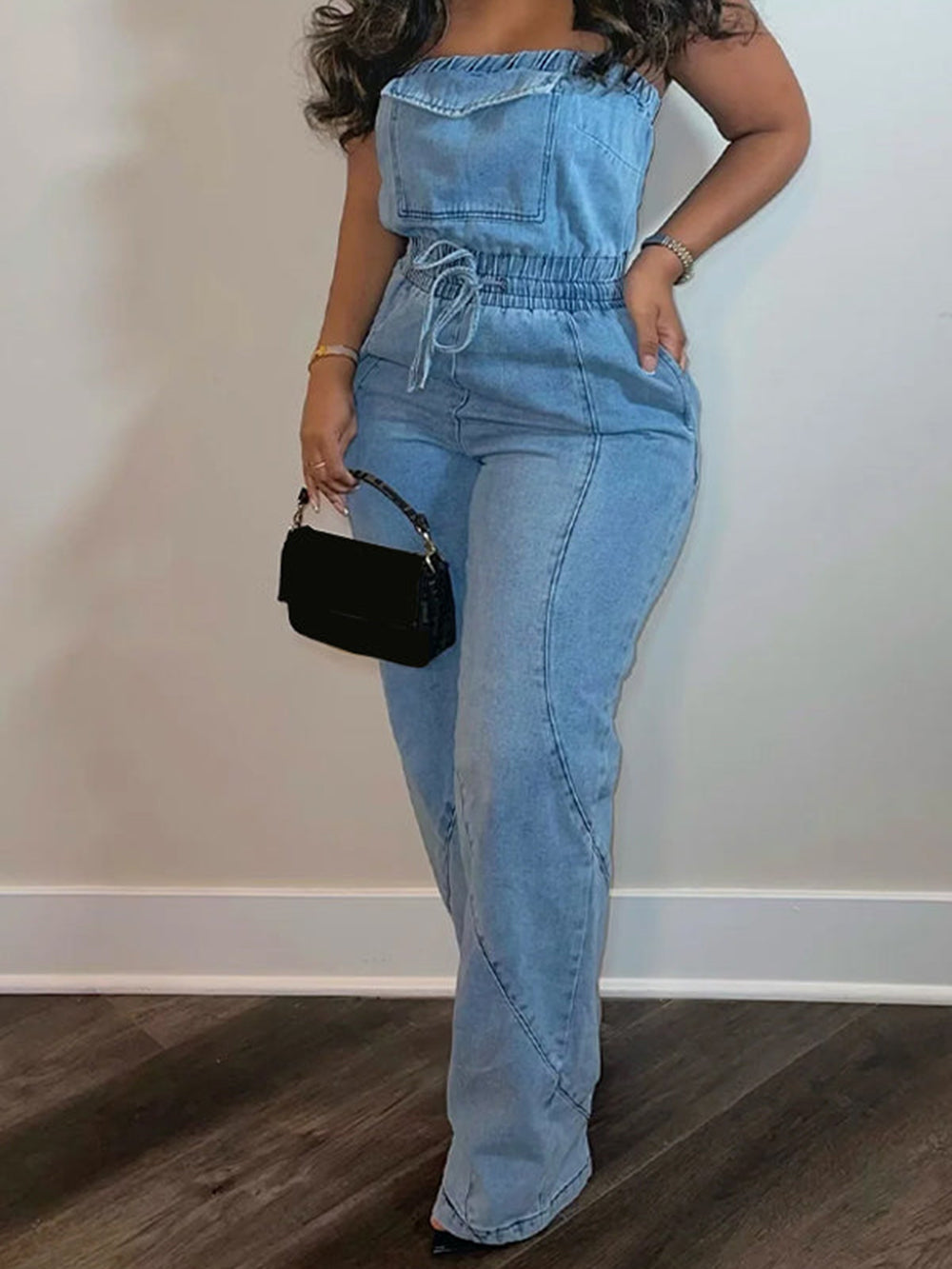 Women's blue denim jumpsuit with lace-up bandeau neckline