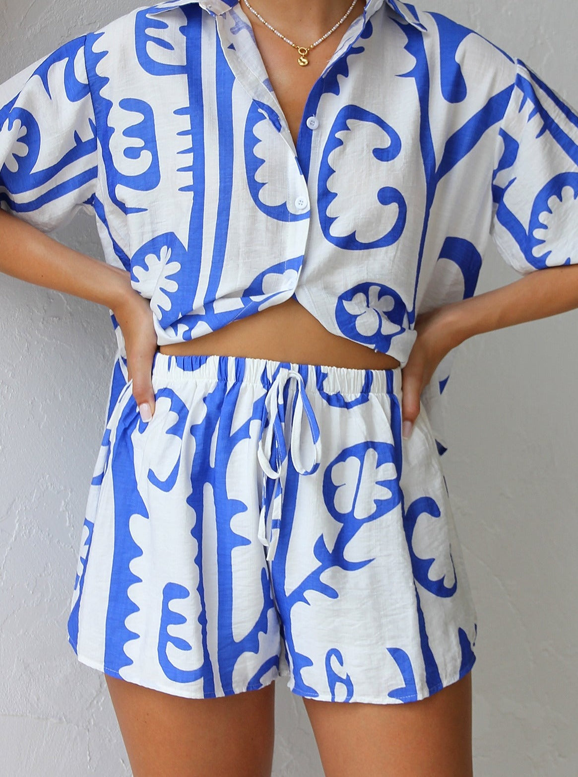 Women's blue contrast print shirt and shorts set — back view