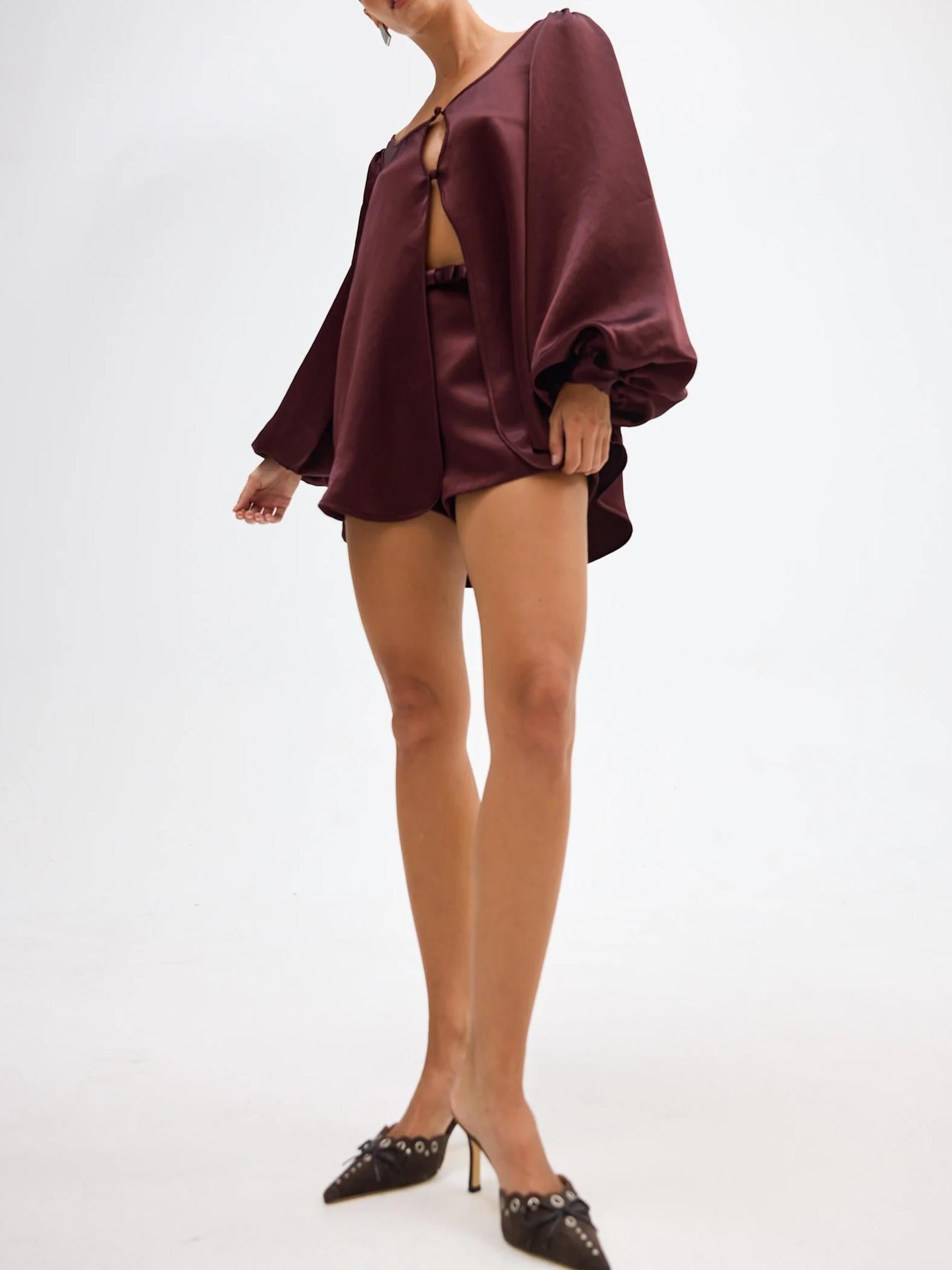 Women's taupe bow-detail blouse and shorts set — back view