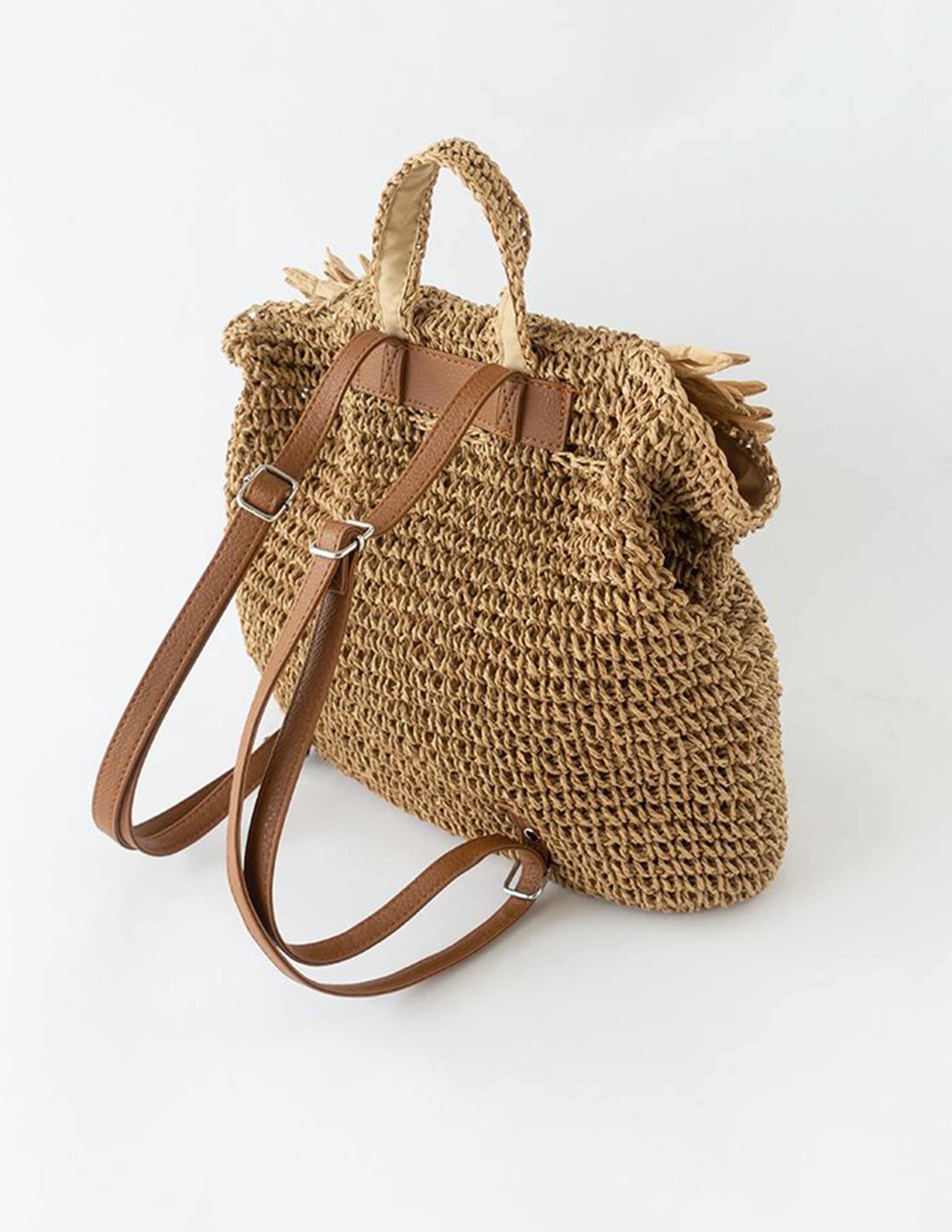 Women's brown fringed woven straw backpack