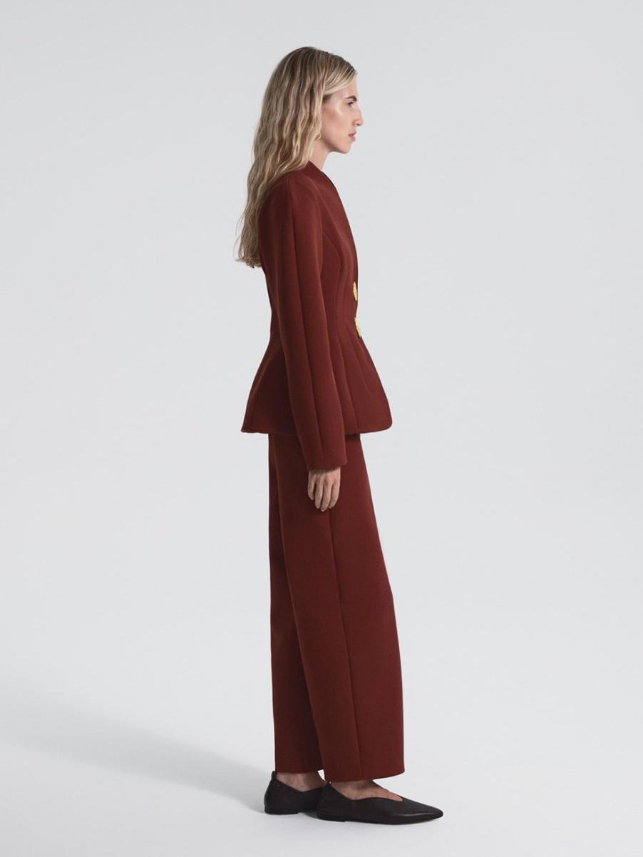 Women's burgundy peplum blazer and trousers set — back view