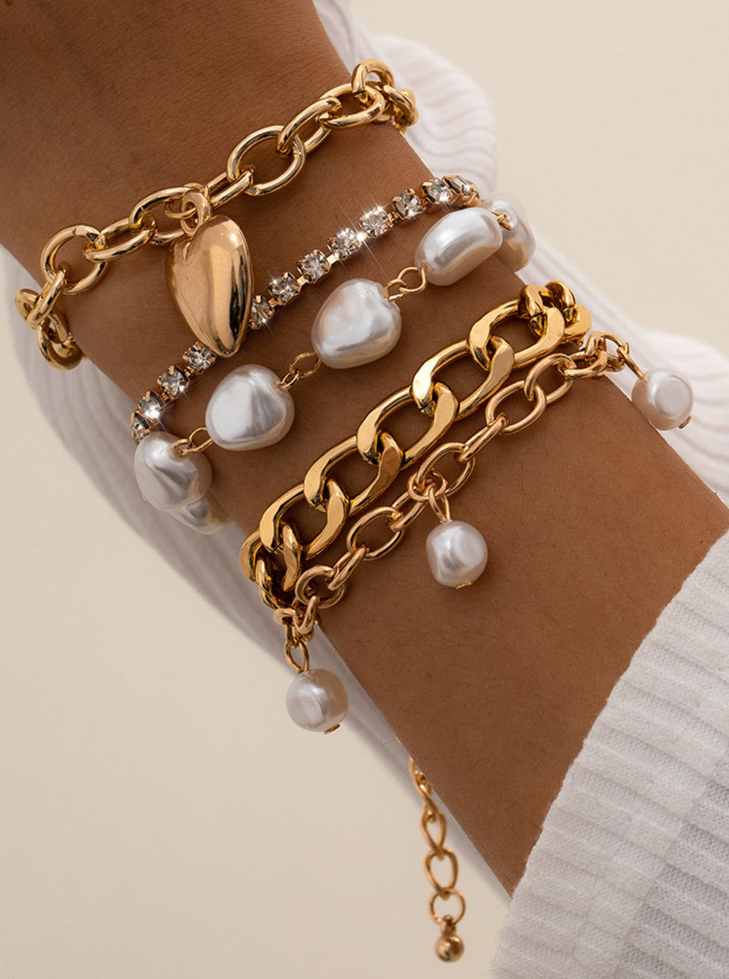 Women's gold chain and pearl layered bracelet