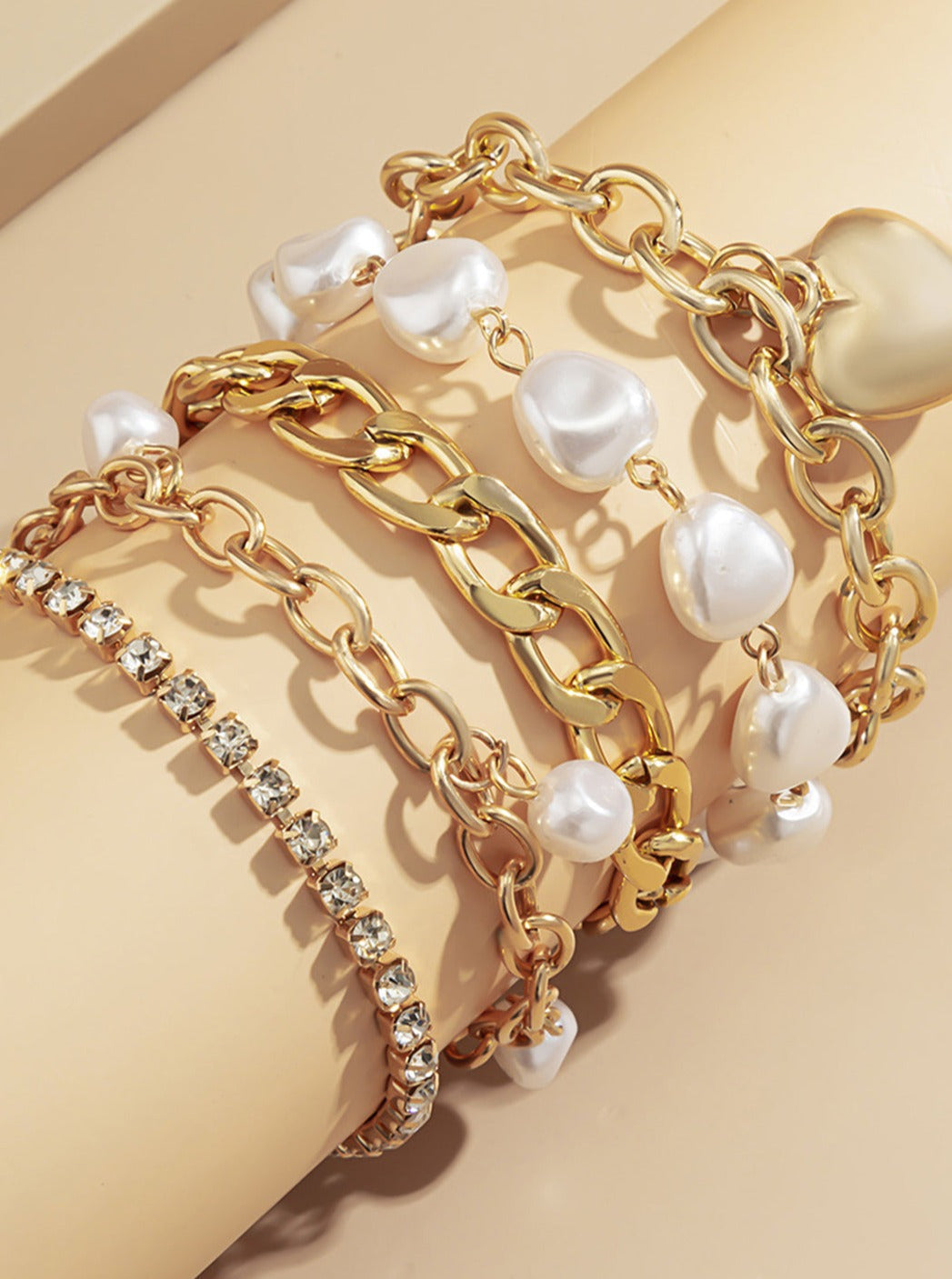 Women's gold chain and pearl layered bracelet — detail