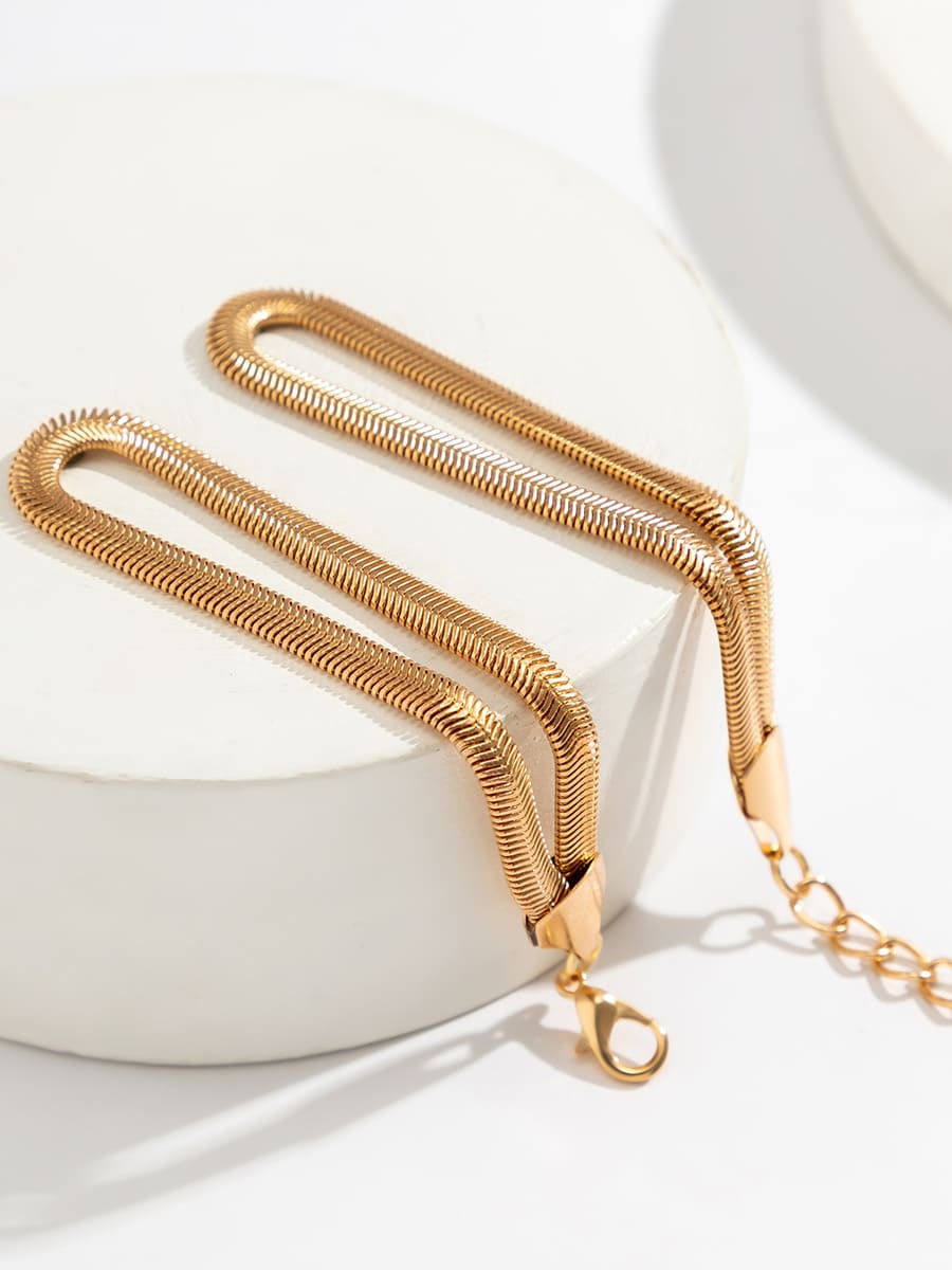 Women's coiled snake chain bracelet — close-up detail